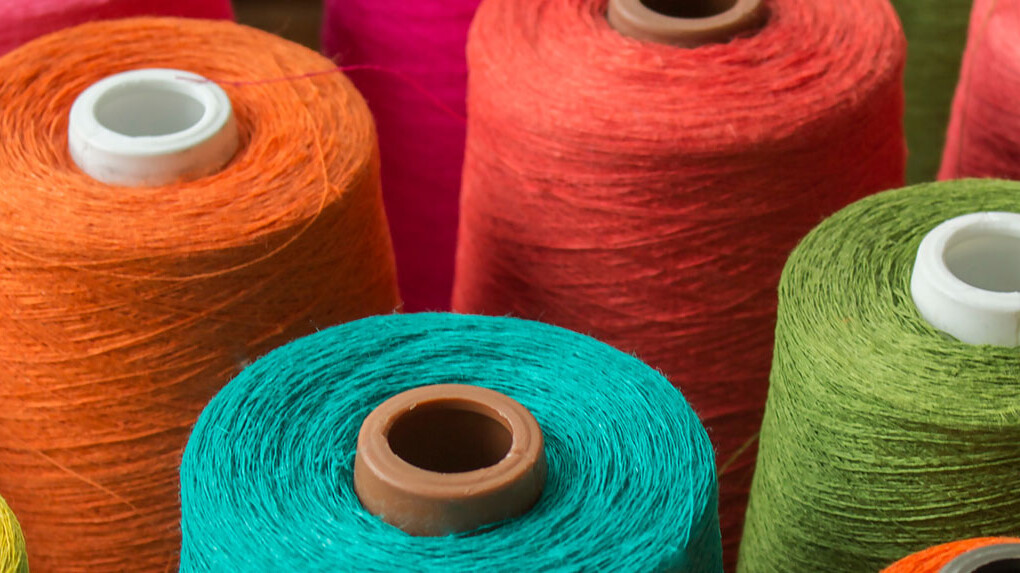 Bobbins with different coloured threads Bobbins with different coloured threads