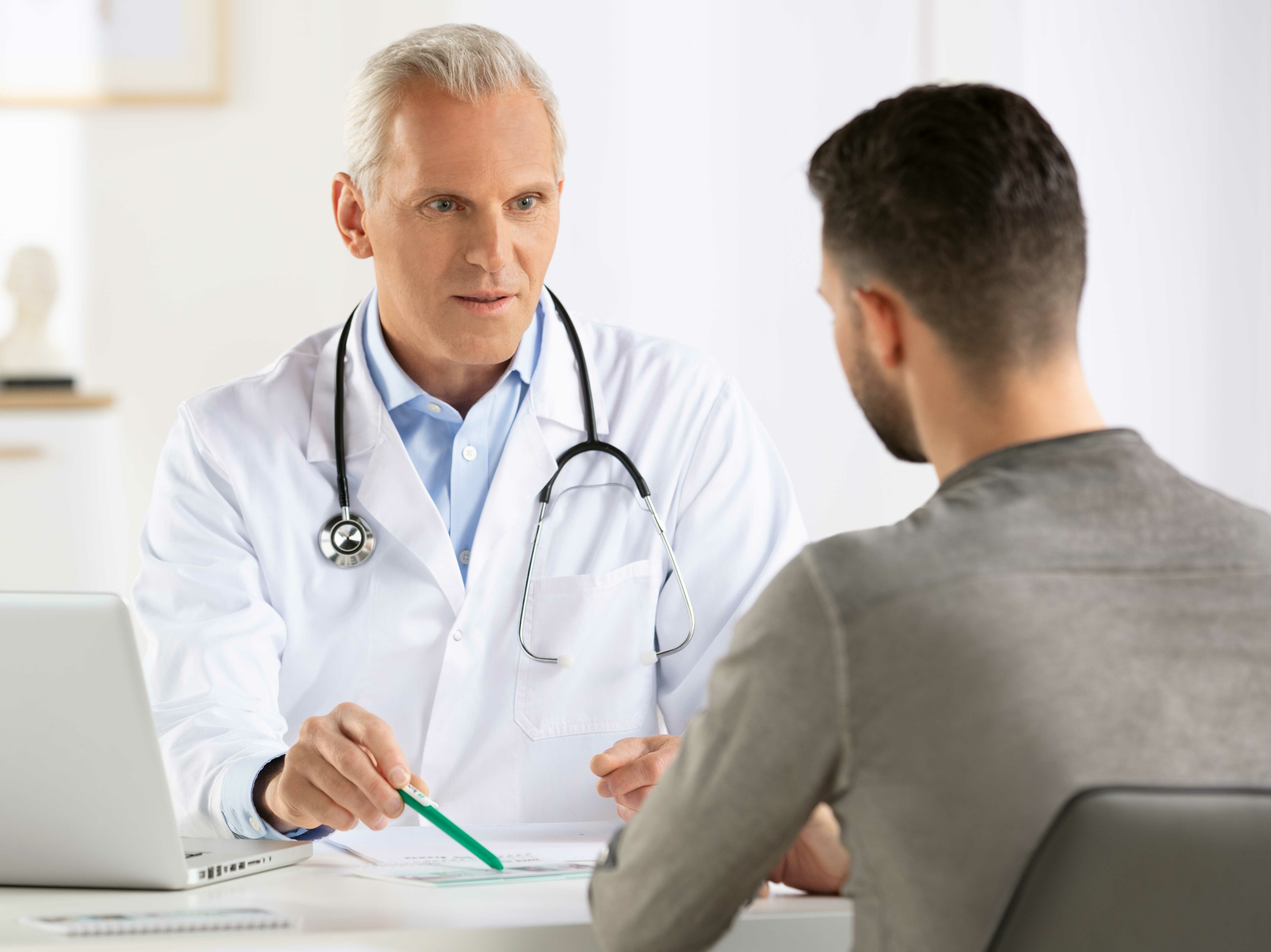 Man at a medical consultation Man at a medical consultation